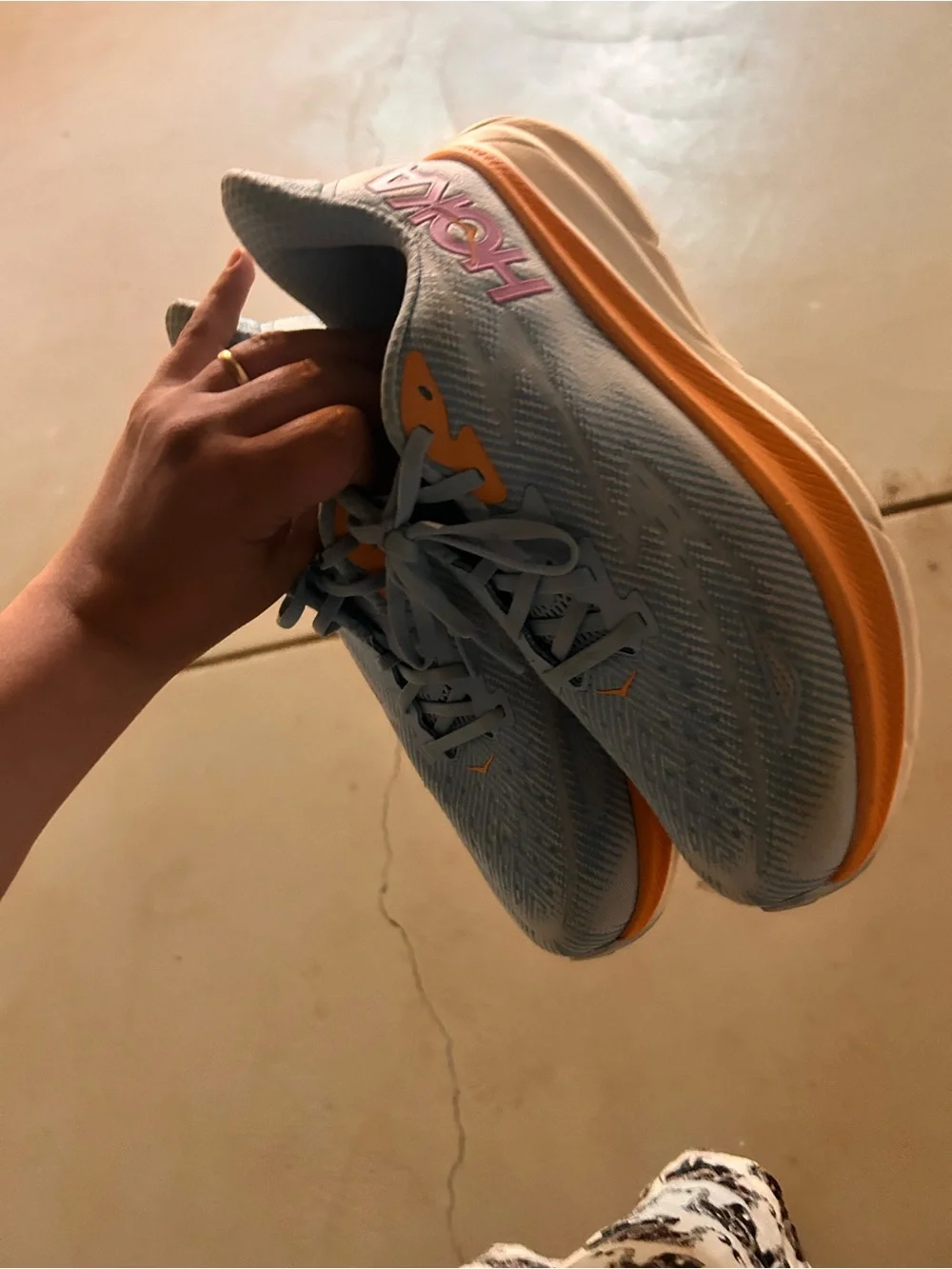 Hoka women Running Sneaker in Light Blue with Orange Accents 9.5D wide